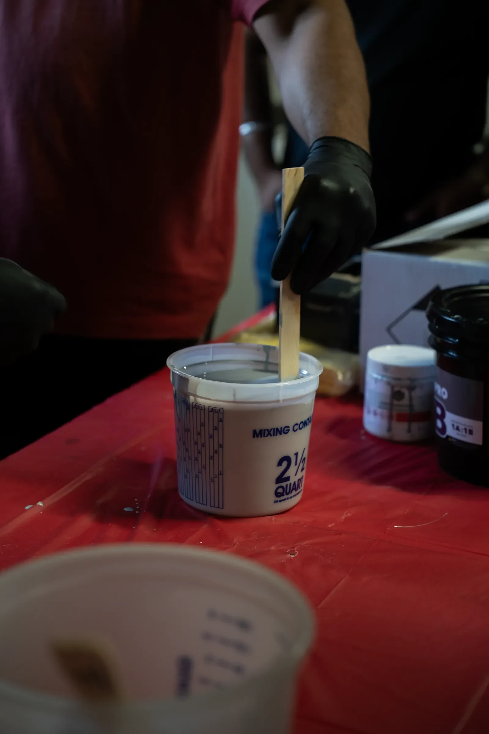 Close-up of epoxy mixing container during training