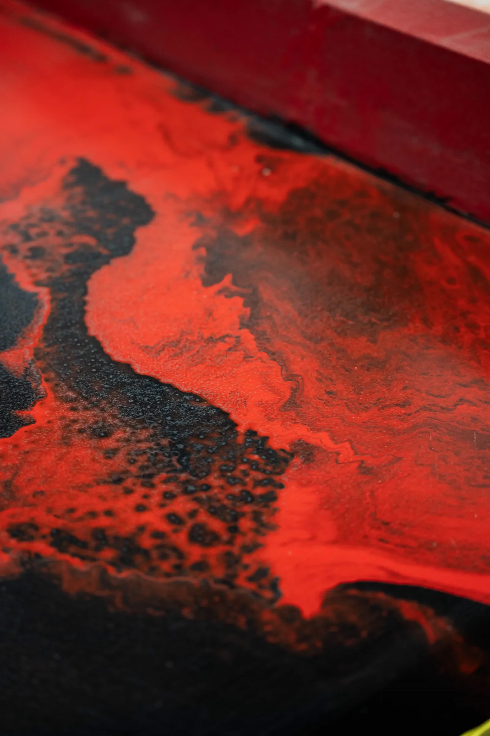 Red and black metallic epoxy floor close-up